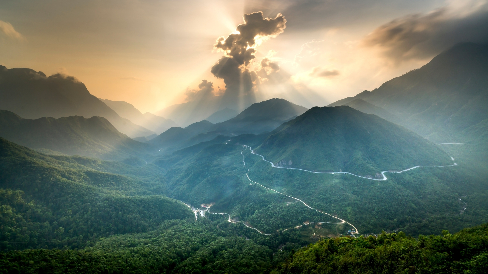 Mountain landscape with winding roads at sunset - Strategic financial planning