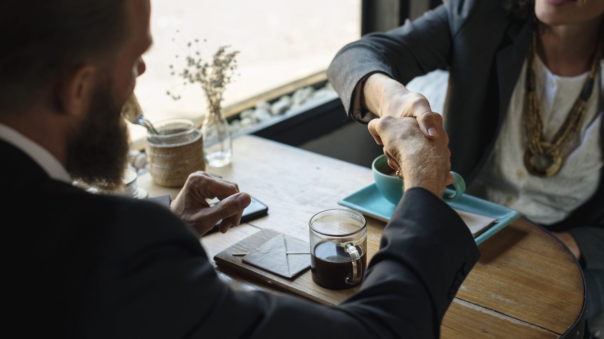 Business handshake symbolising a buy-sell agreement between dental partners