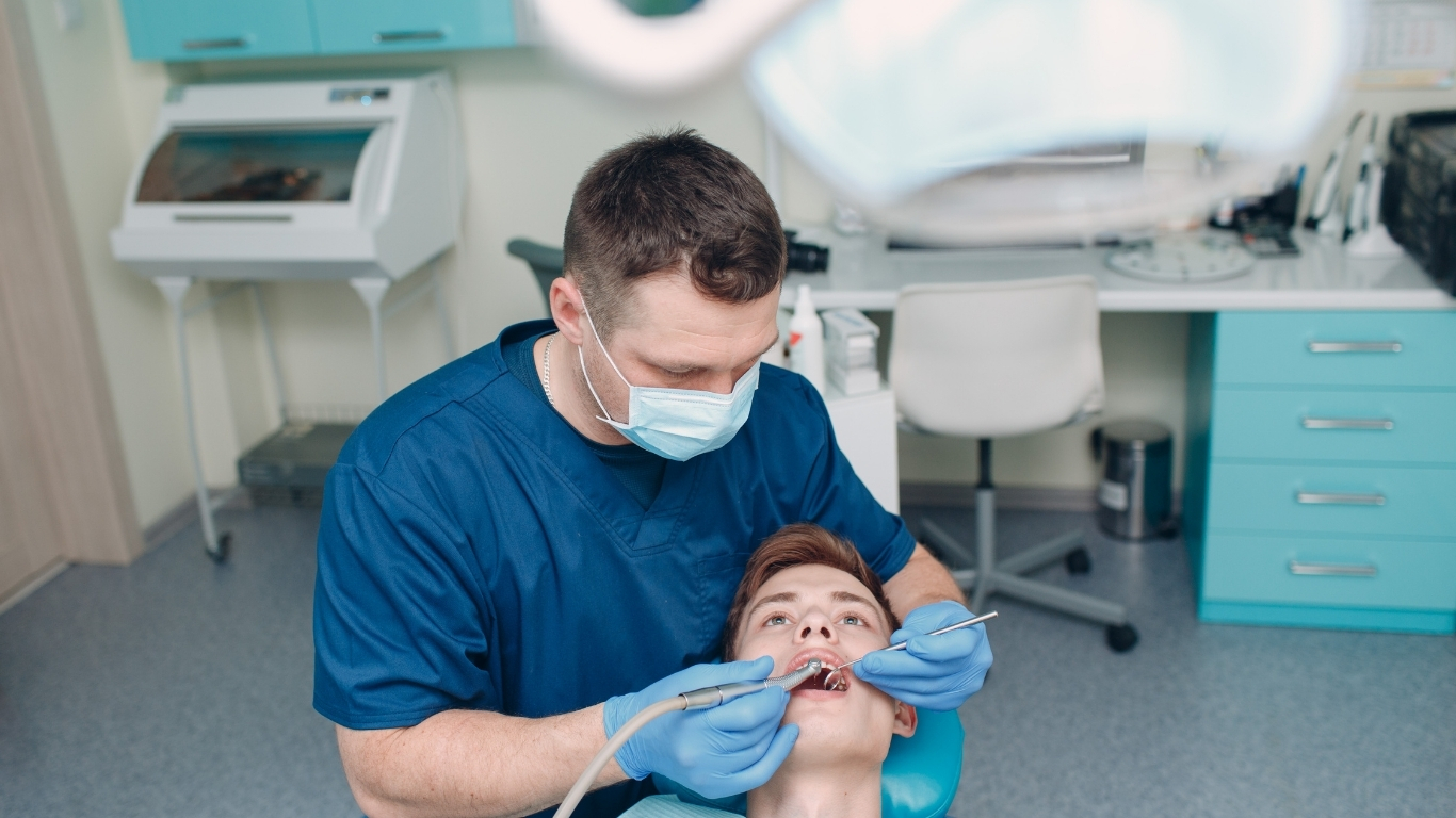 Dentist with patient discussing insurance needs